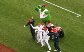 Phillies players on the field with the Phanatic