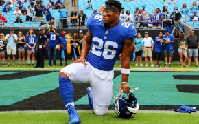 Saquon Barkley takes a knee on the field
