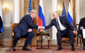 Donald Trump and Putin shake hands in Helsinki.